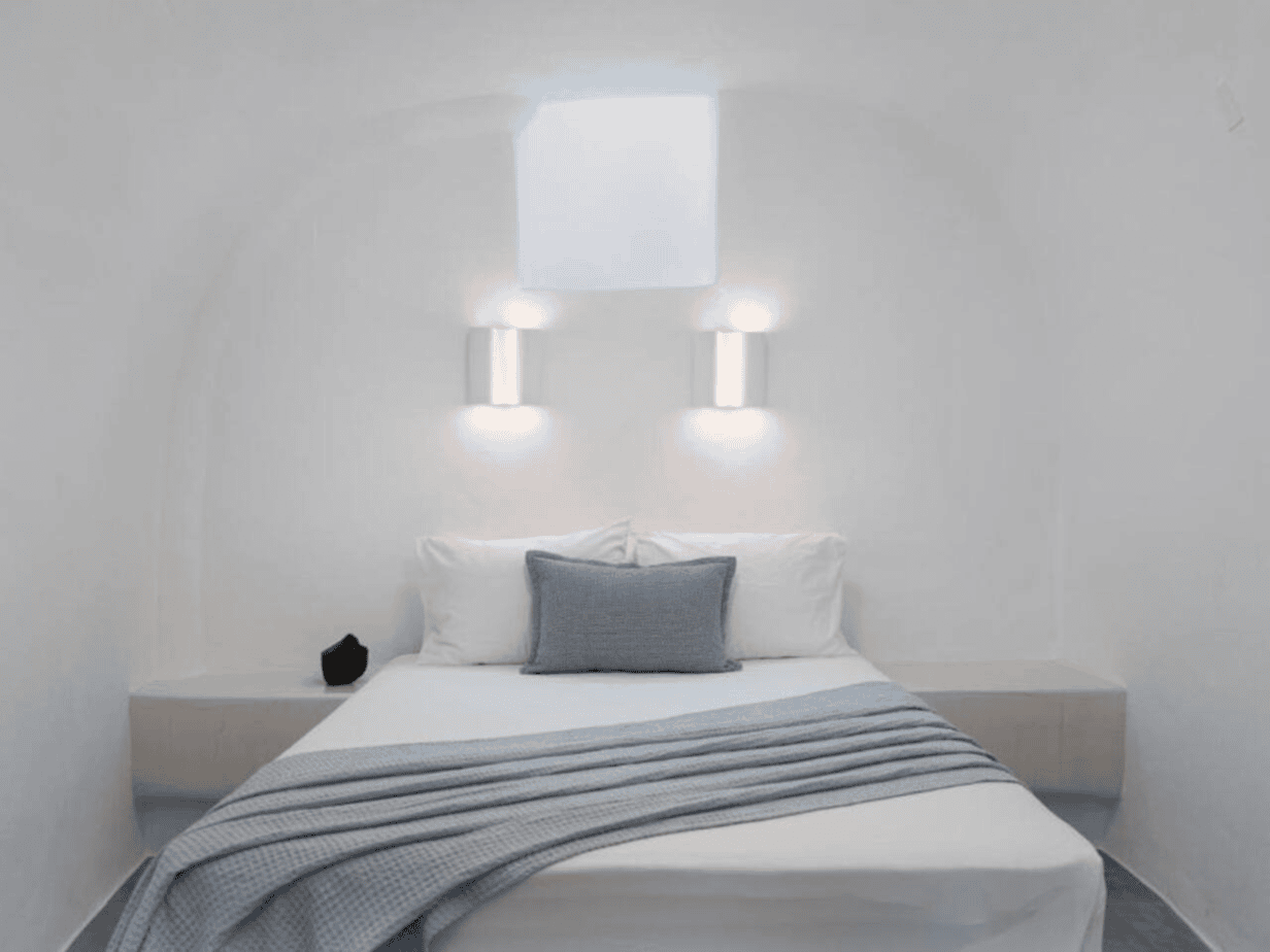 Daedalos room in Santorini secret villa with queen bed and curved ceiling