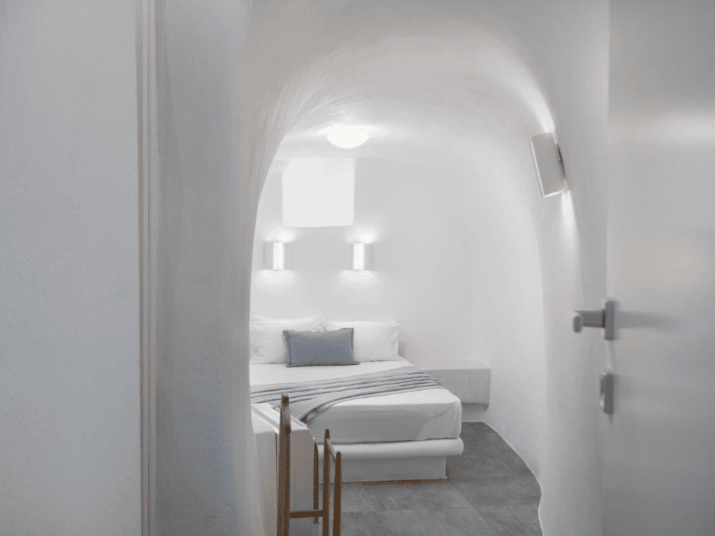 Daedalos room in Santorini secret villa with queen bed and curved ceiling