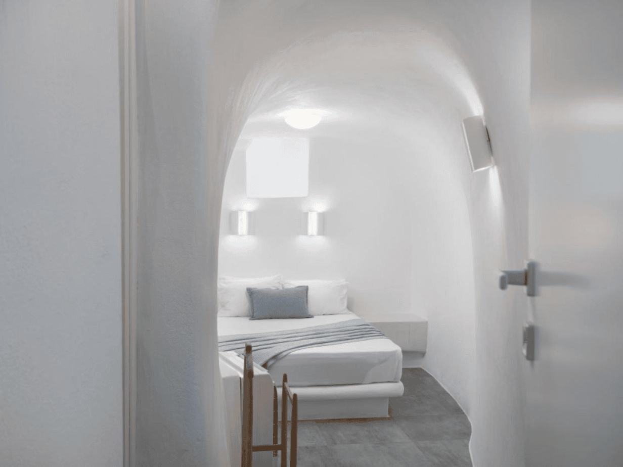 Daedalos room in Santorini secret villa with queen bed and curved ceiling