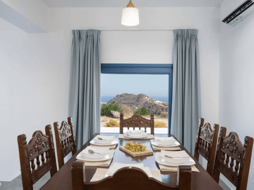 Dining area for 6 at Santorini secret villa with panoramic windows