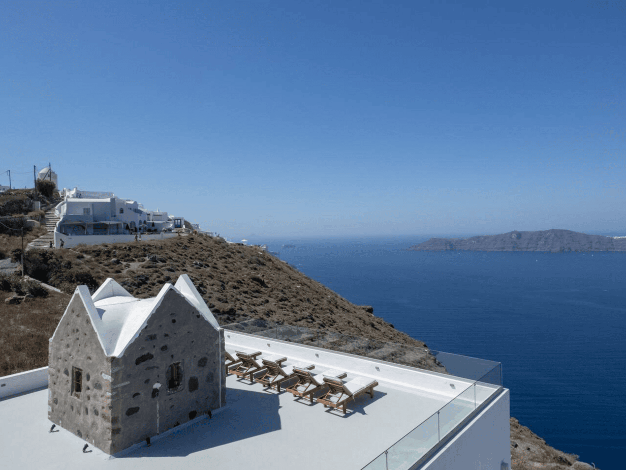 Sunbeds with Aegean Sea view at Santorini secret villa